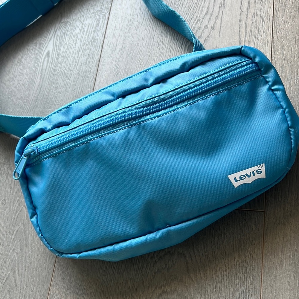 Levi's medium blue sling bag, new without tag.